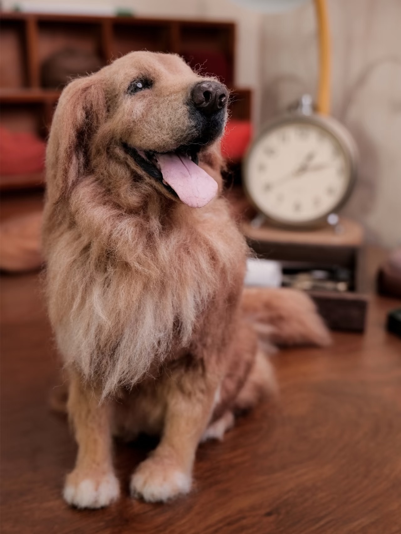 Handcrafted wool sculpture of a golden retriever